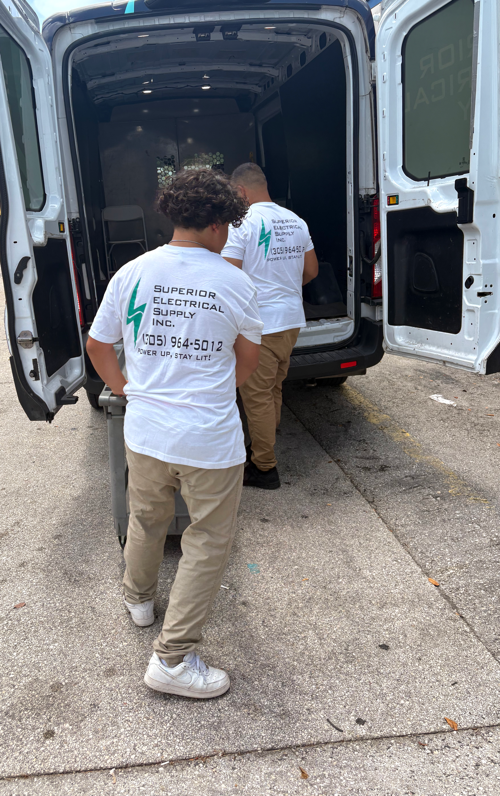 Superior Electrical Supply team Marco and Gio loading delivery van in Miami Florida for free same day delivery service to South Florida customers